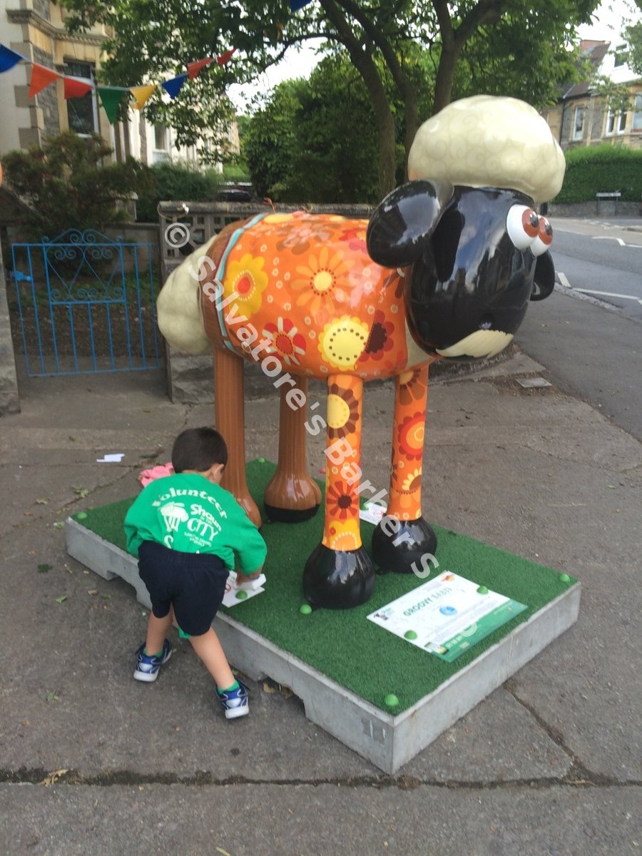 Groovy Baby!, the Shaun the Sheep sculpture sponsored by the Coldharbour Road traders, being cleaned on Coldharbour Road