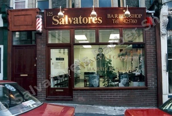 Salvatore's shopfront on opening day in 1994, mahogany fascia with gold lettering and a barber pole